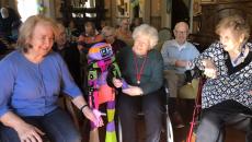 Senior residents at Allity interacting with the companion robot Abi by Andromeda Robotics