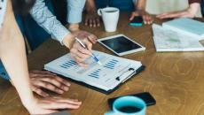 Workers looking at financial documents