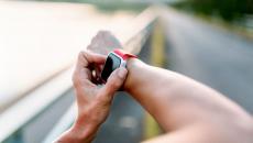 A close up of a person wearing a smartwatch.