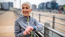 A person sporting a smartwatch while on a run