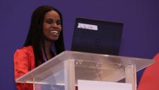 Dr. Yaa Kumah-Crystal speaks at a podium at HIMSS21.
